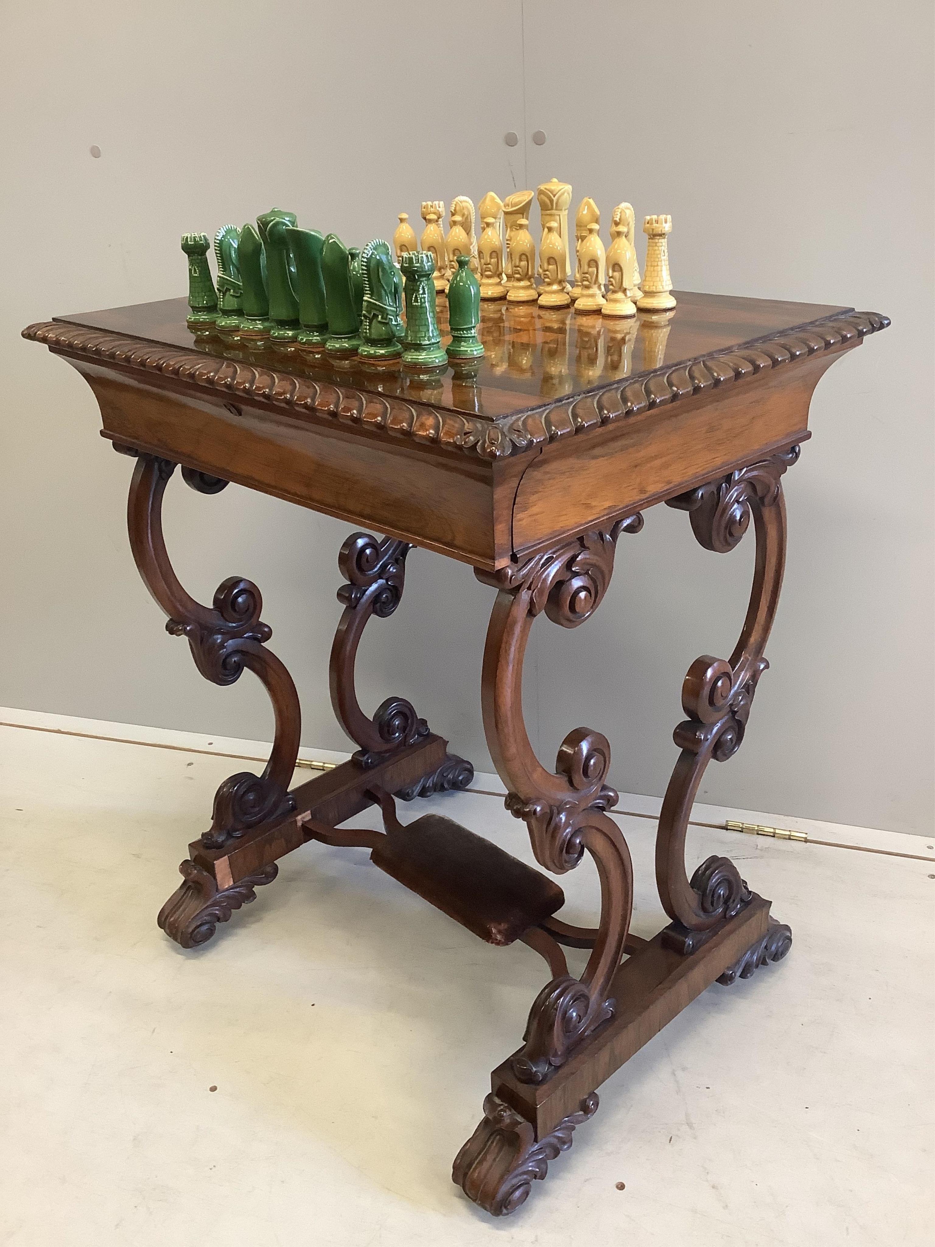 A Victorian rosewood chess top table, with chess pieces, width 66cm, depth 50cm, height 76cm
